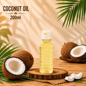 Indway Fresh 200ml cold pressed coconut oil in a clear bottle with fresh coconuts